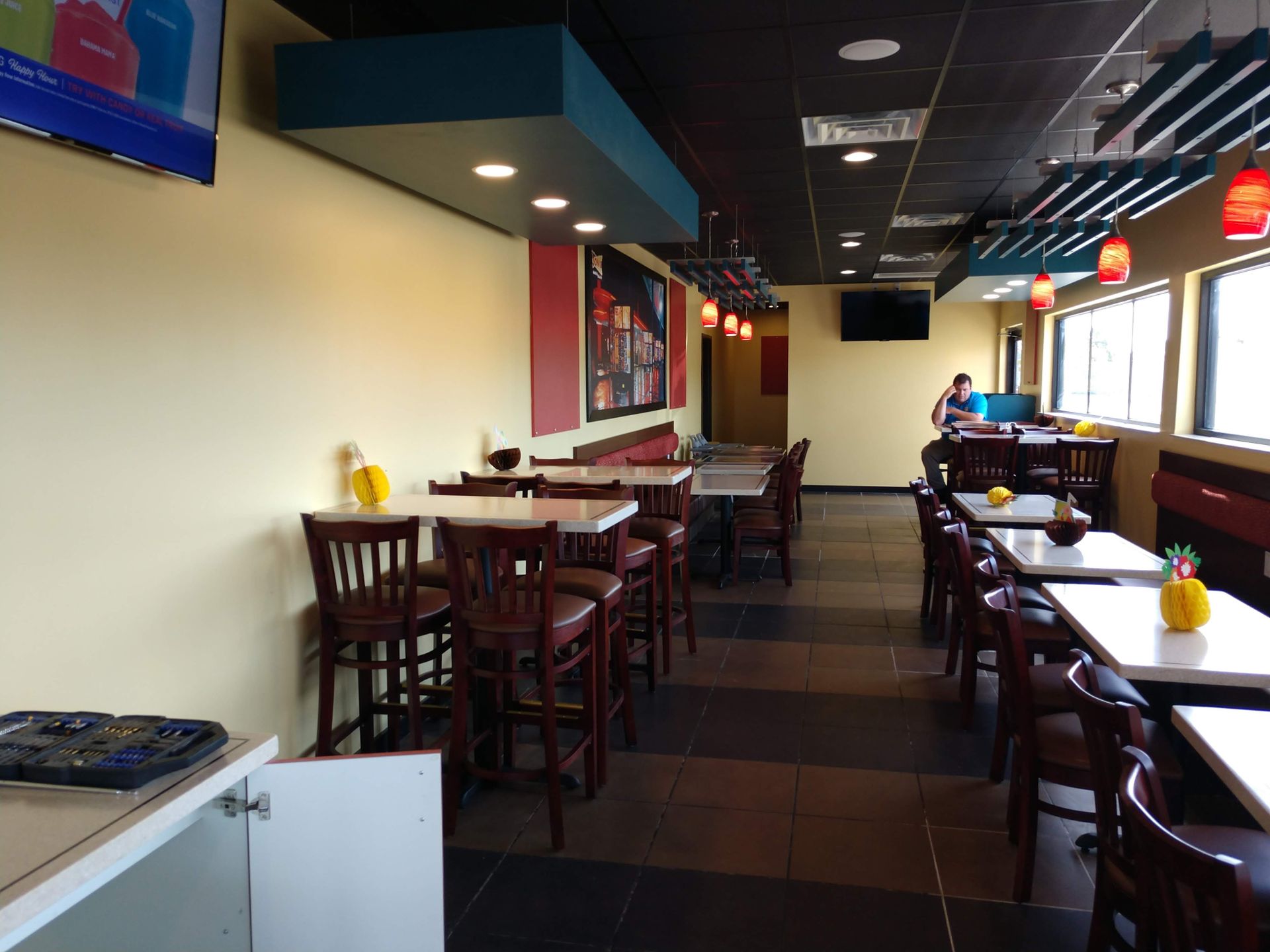 A restaurant with pineapples on the tables and chairs