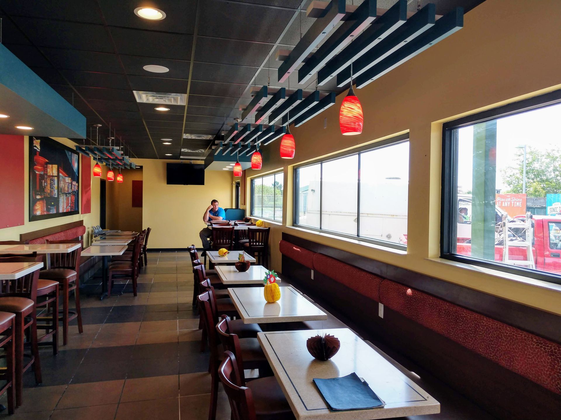 A restaurant with a lot of tables and chairs