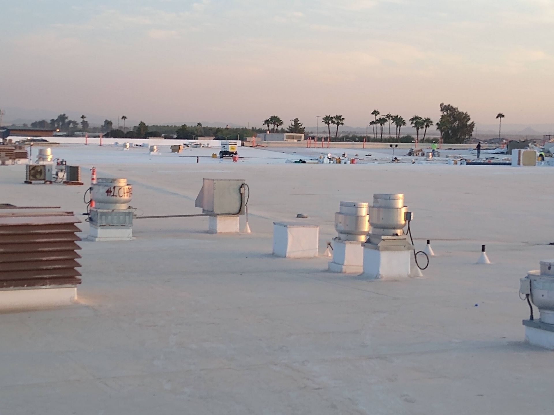 The roof of a building with a lot of fans on it