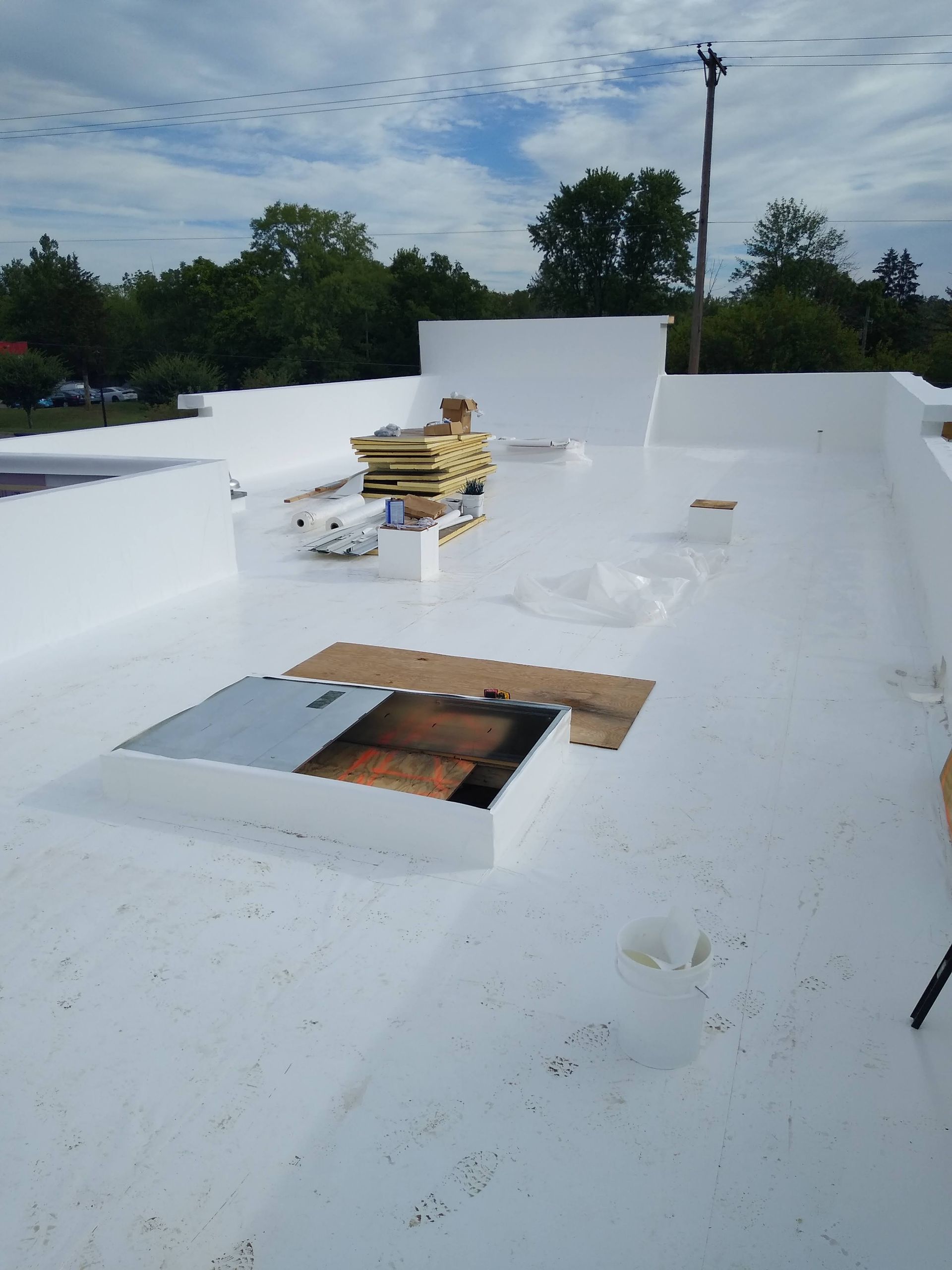 A white roof with a hole in the middle of it