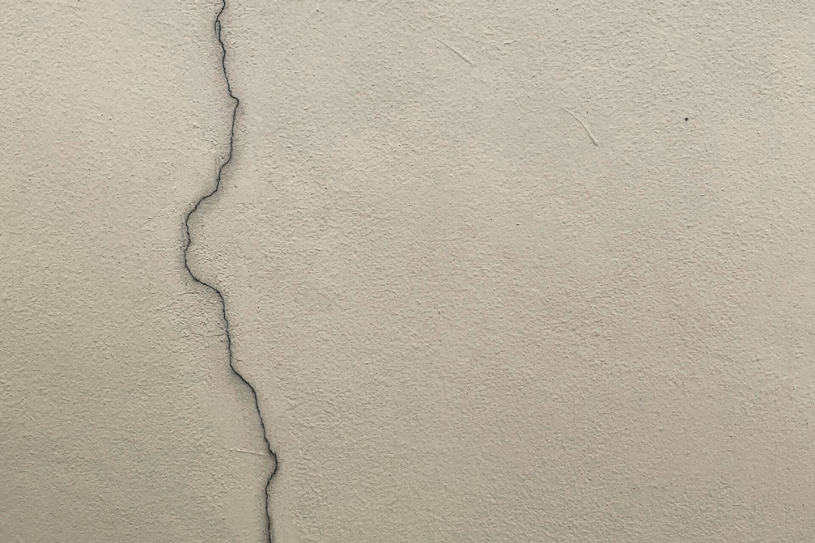 Concrete crack forming along a slab surface showing early signs of concrete damage and movement
