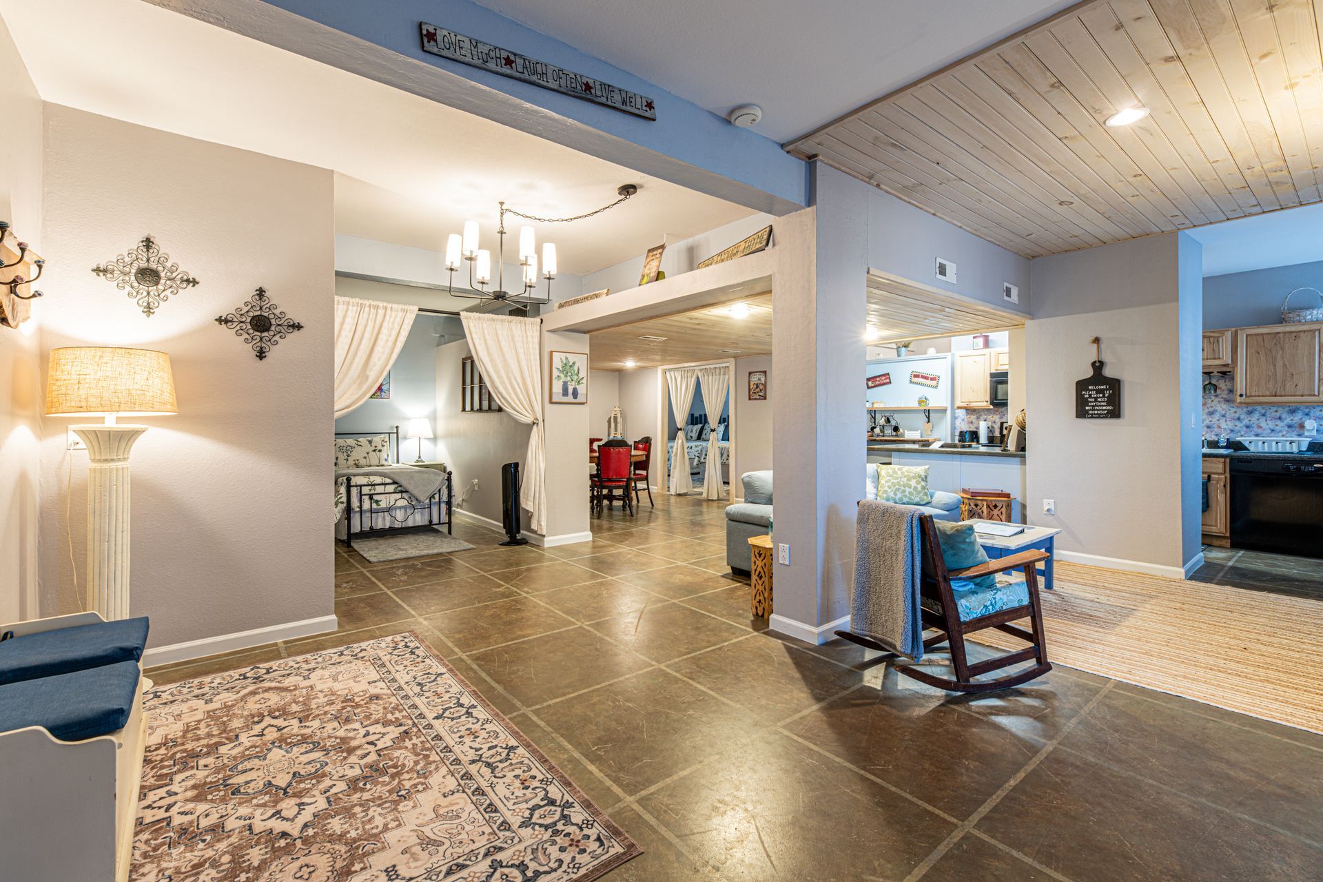 Spacious interior with living, dining, and kitchen areas. 