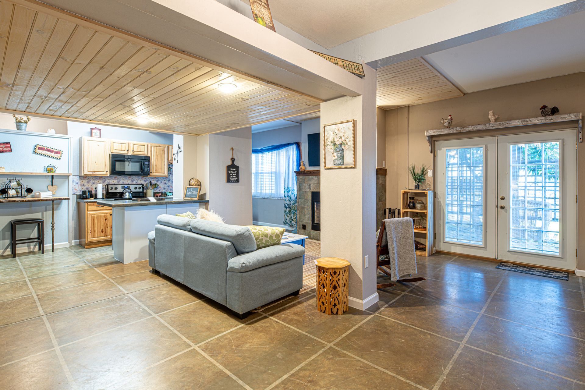 Open-concept living space with kitchen and living room. 