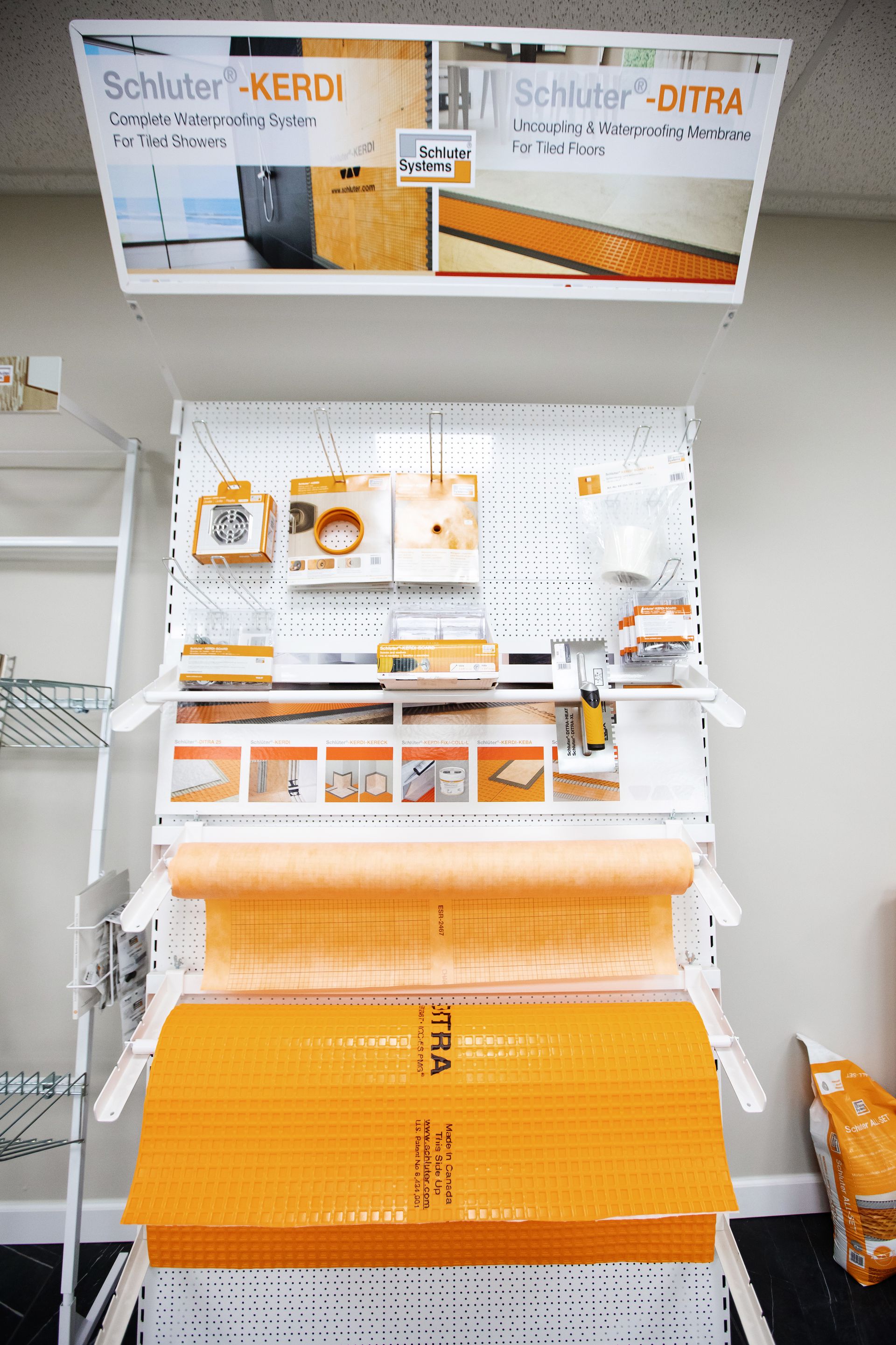 A close up of a concrete floor with a metal railing.