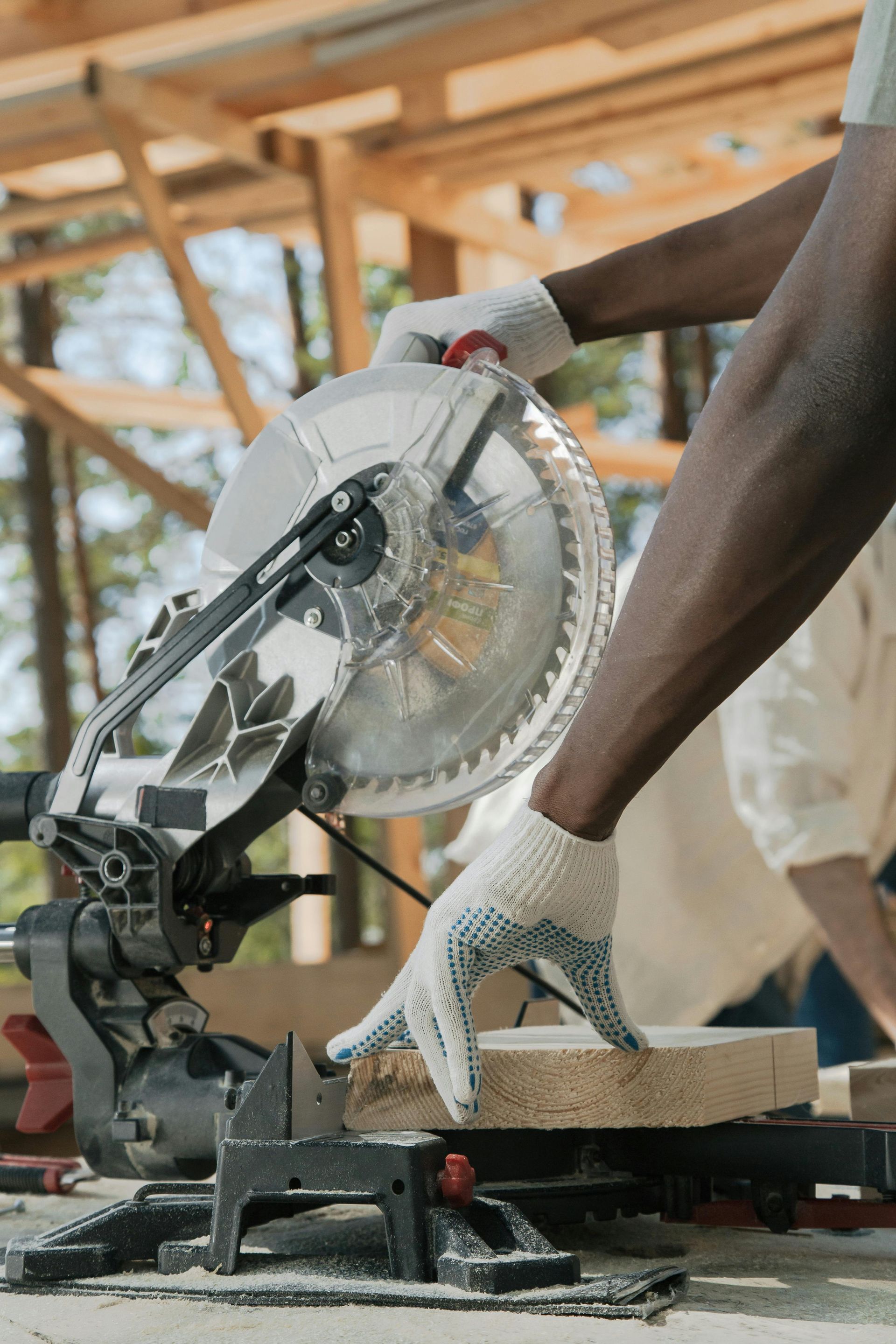 A home builder preparing wood for the construction of the new house.