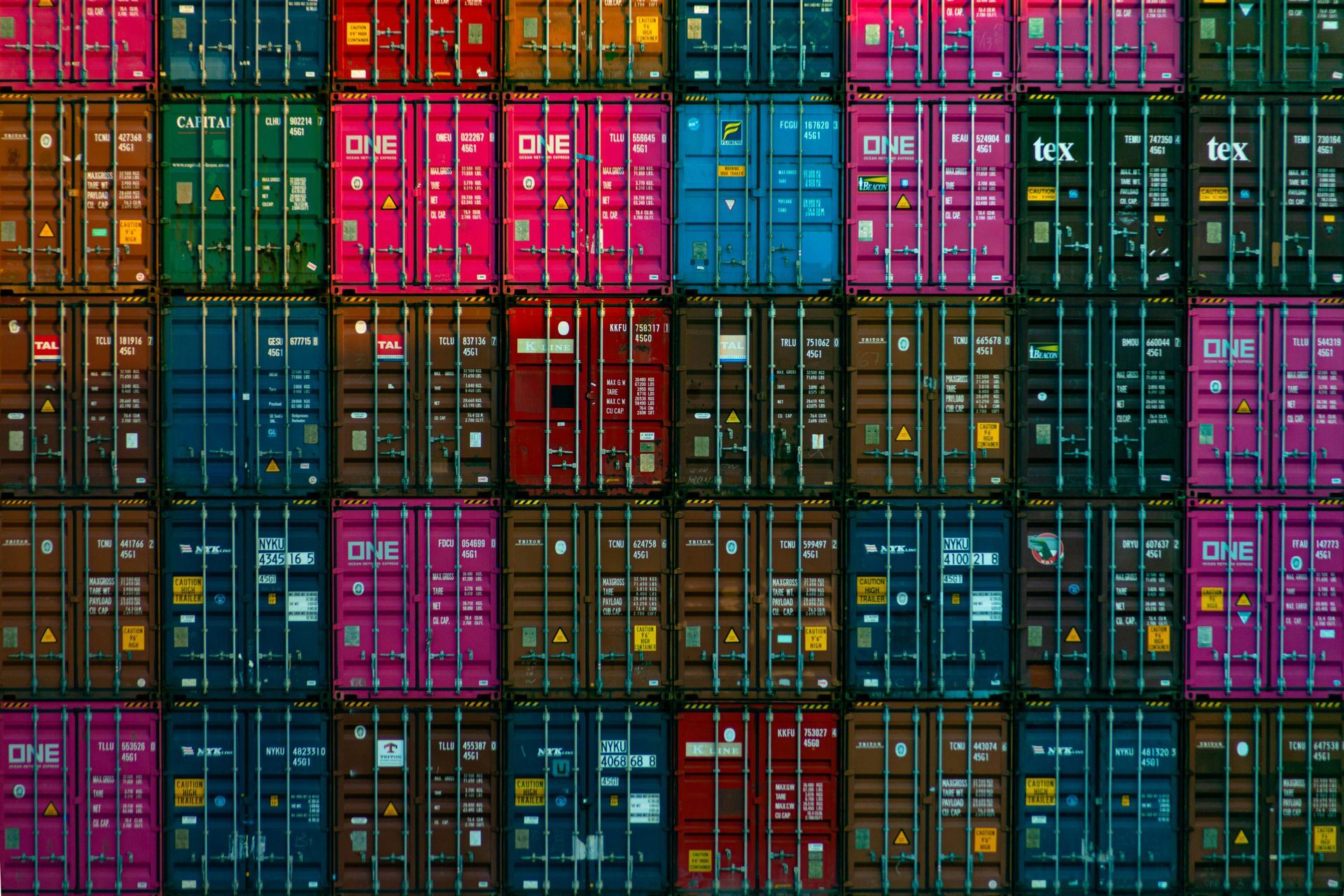 A bunch of shipping containers are stacked on top of each other