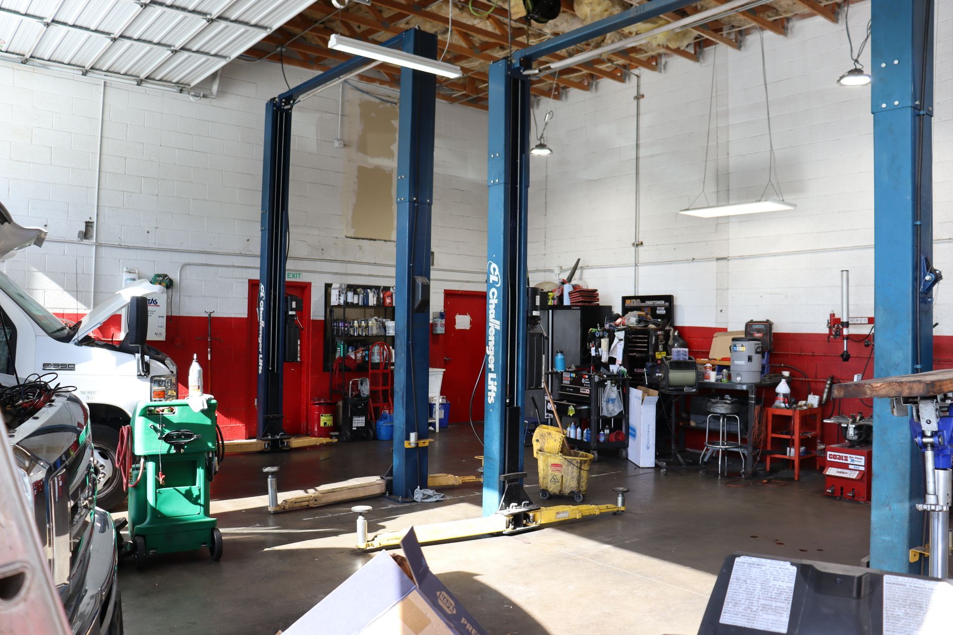 A Car Is Sitting on a Lift in a Garage | Copperstate Auto And Fleet