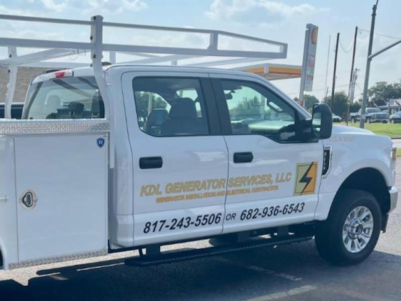 A white truck with kdz generator services written on the side
