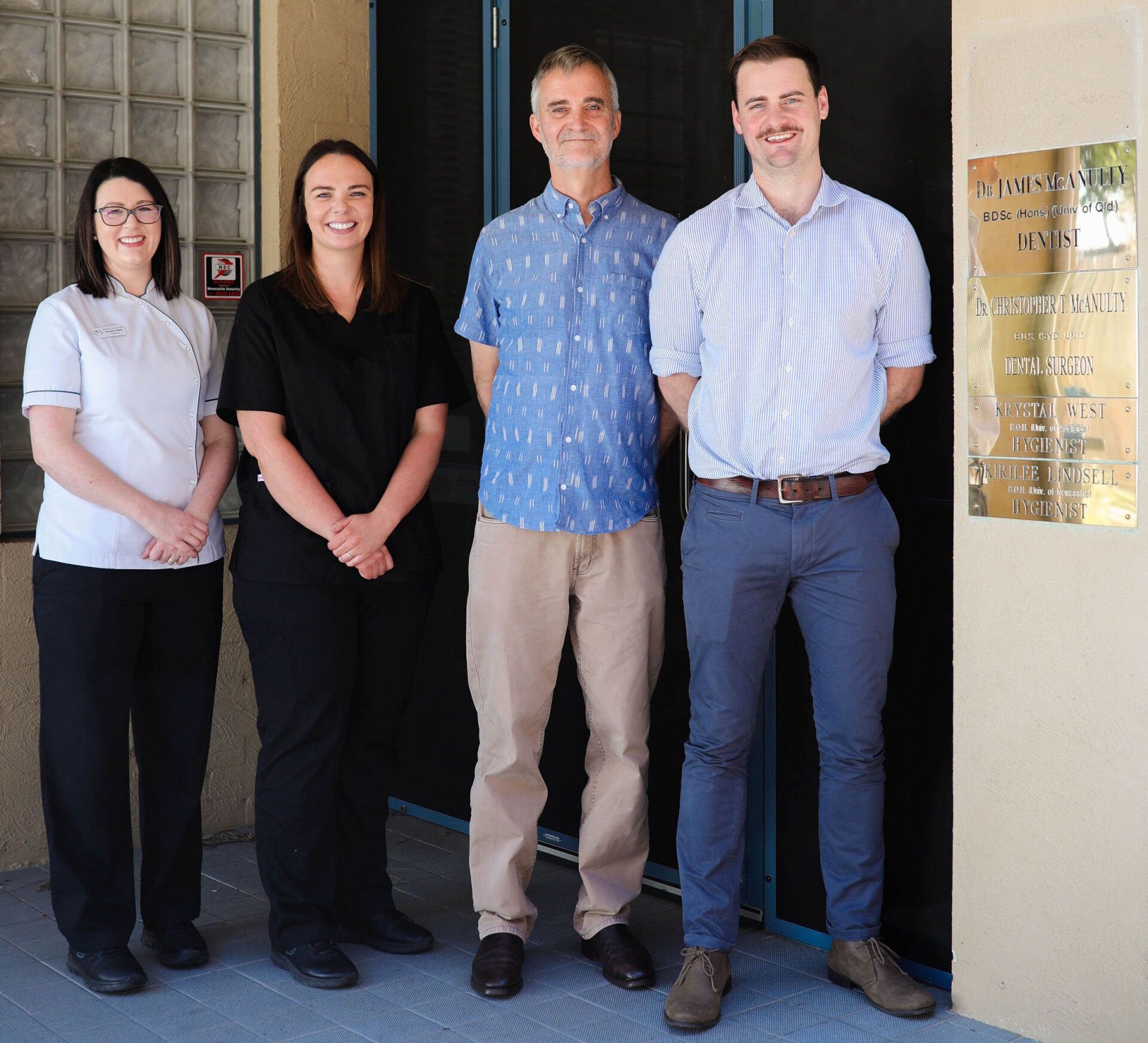 A group of people standing in front of a sign that says emergency room — Maitland Dental Care In Maitland NSW