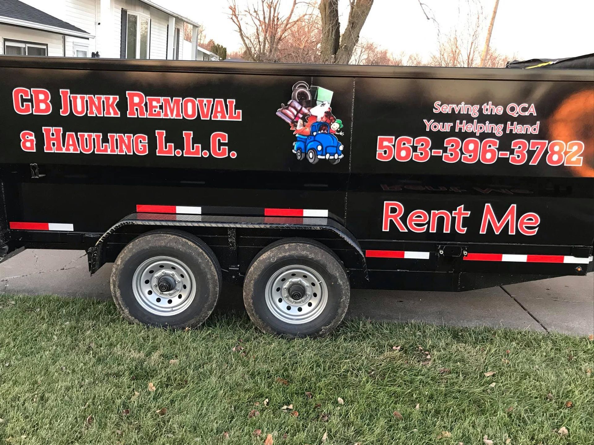A black trailer that says rent me on it
