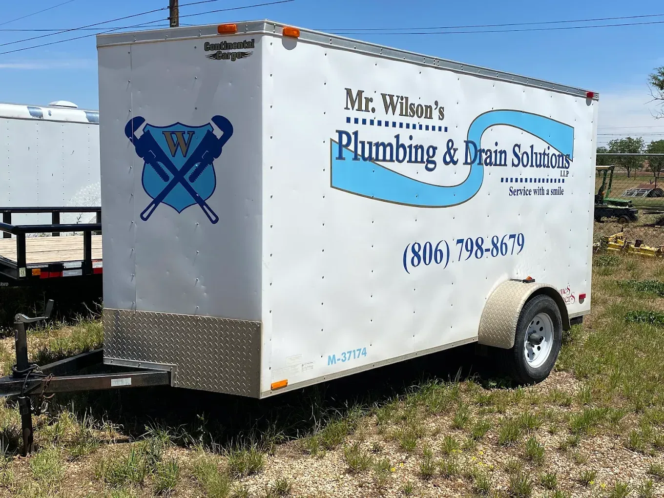 A trailer for mr. wilson 's plumbing and drain solutions