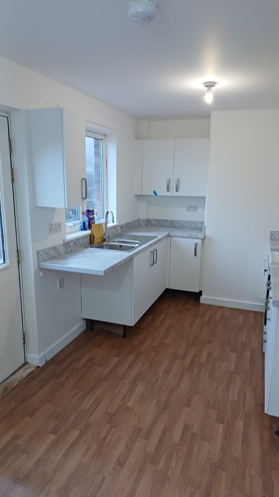 Social housing kitchen refresh – durable and wipeable surfaces painted for easy tenant maintenance and long-term appeal