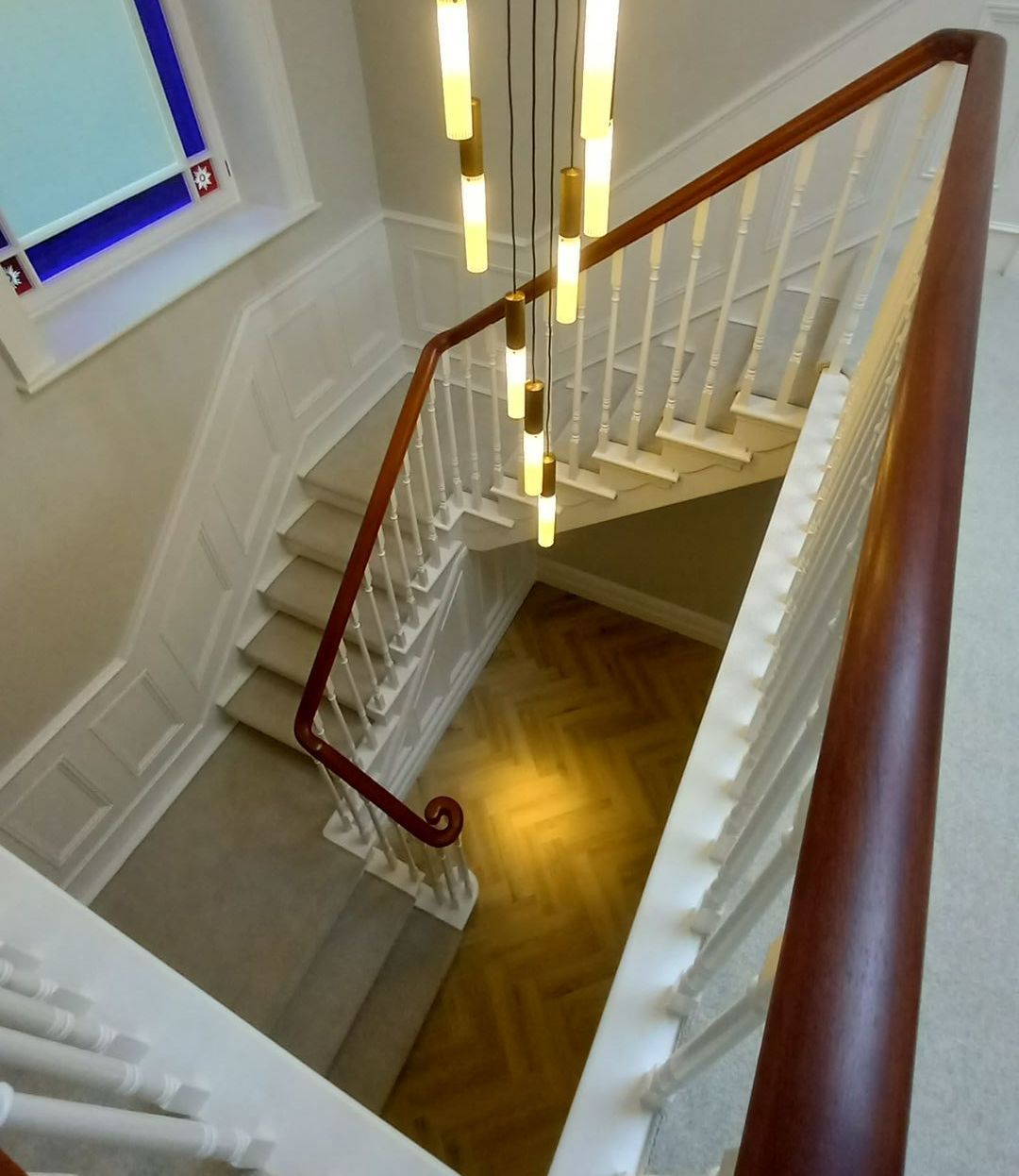 interior hallway painting and decorating - wood panelling - handrail - lighting
