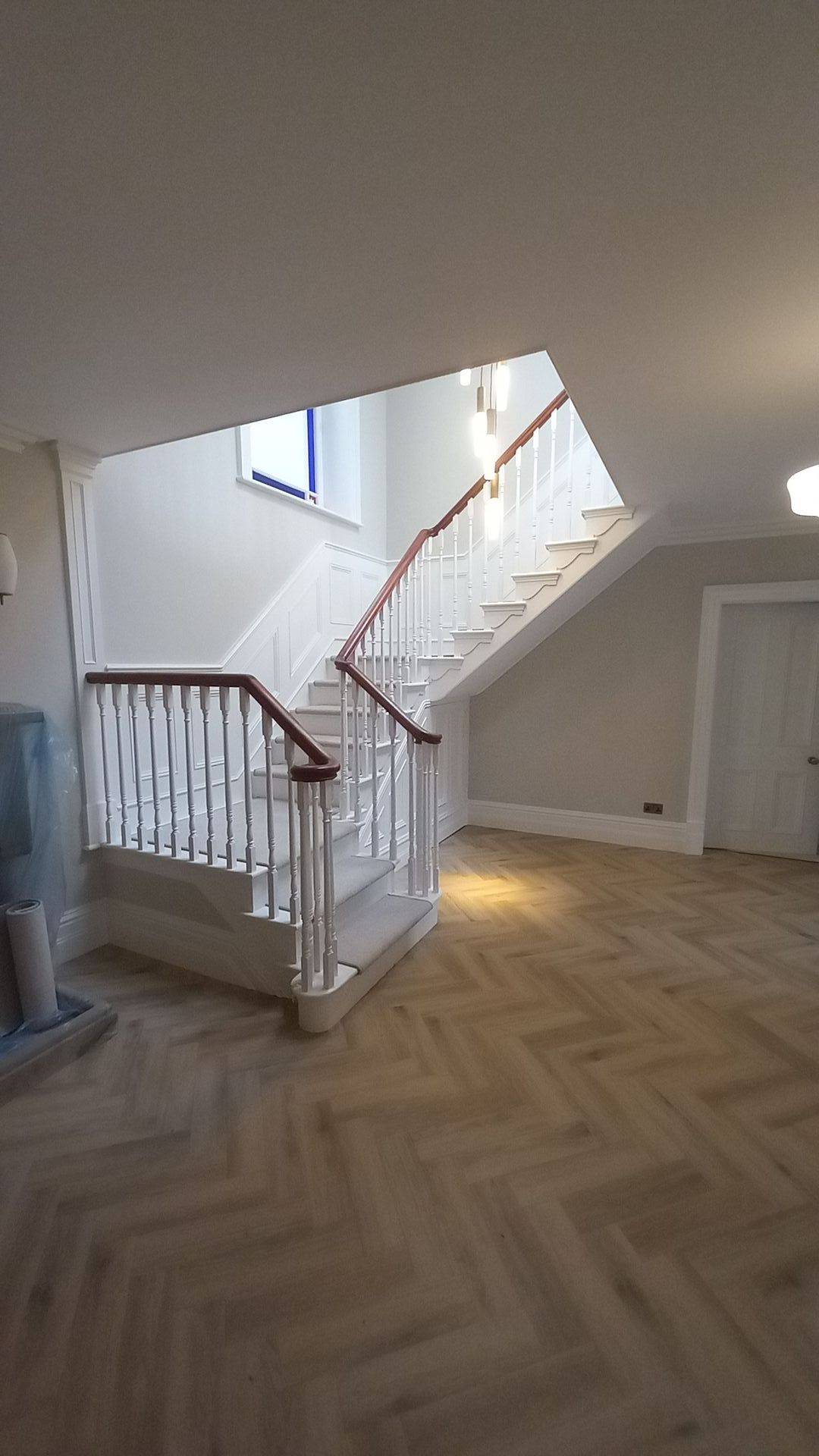 interior hallway painting and decorating - wood panelling - handrail - lighting