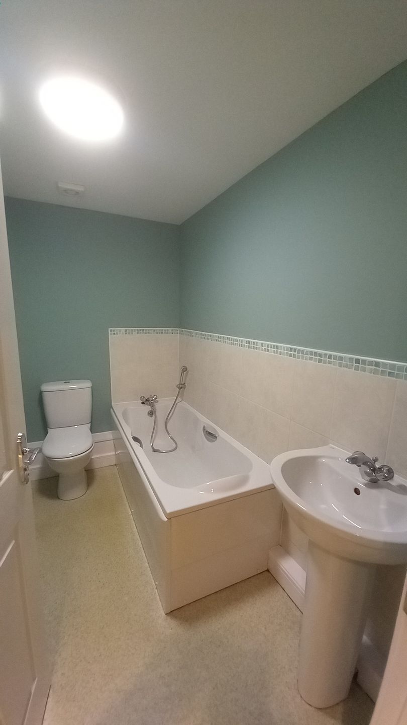 Social housing bathroom painting – suite protected, walls refreshed with low-odour finishes to minimise tenant impact