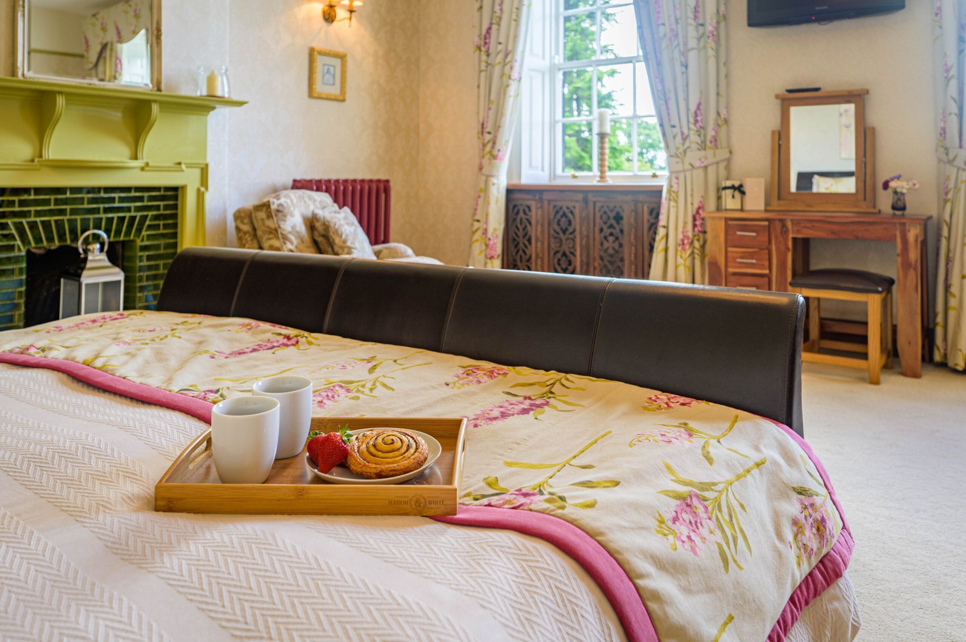 Sympathetic heritage bathroom refresh – deep purple walls and classic roll-top bath finished with moisture-resistant coatings