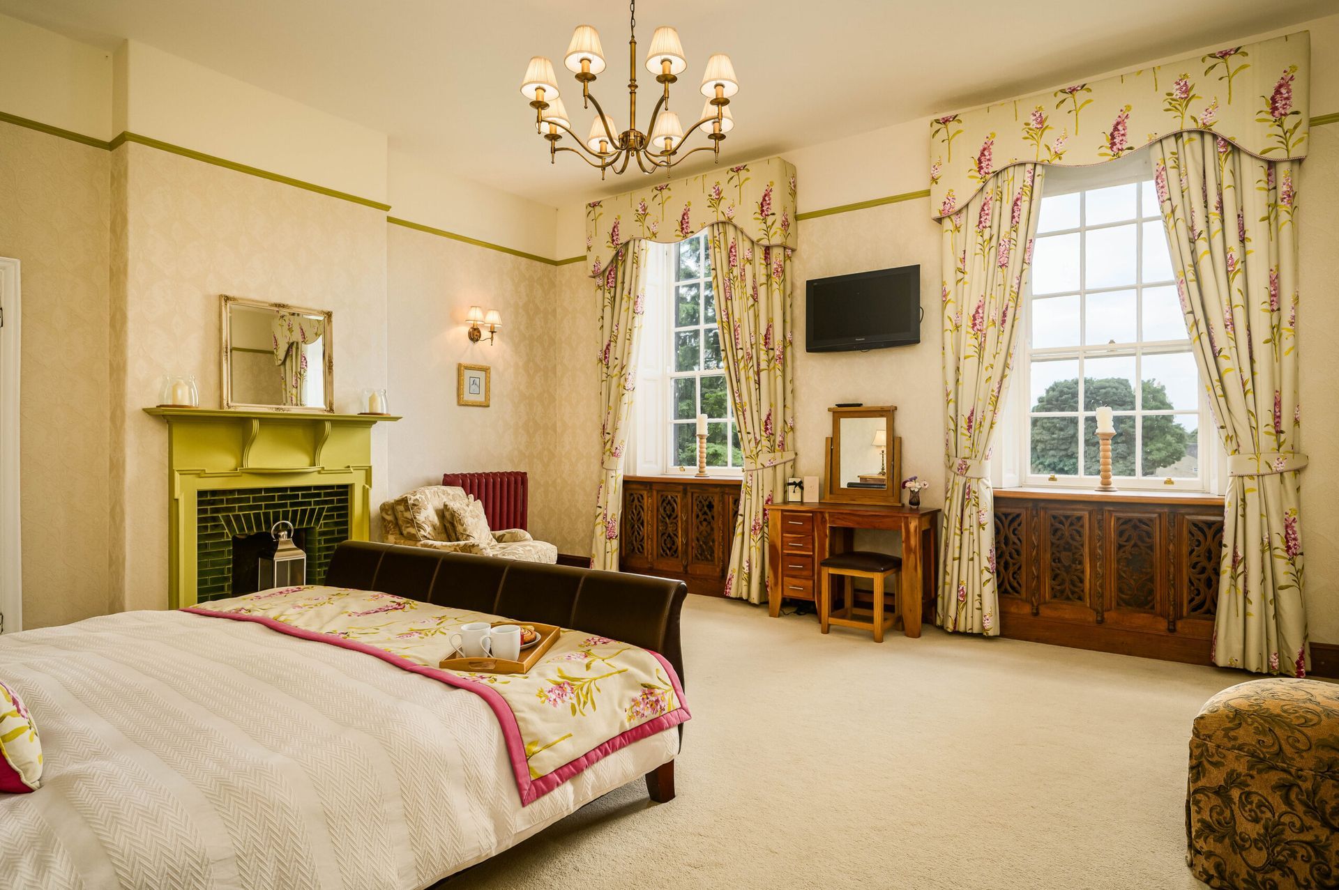 Restored period bedroom in soft neutrals – breathable paint and original fireplace preserved for timeless elegance