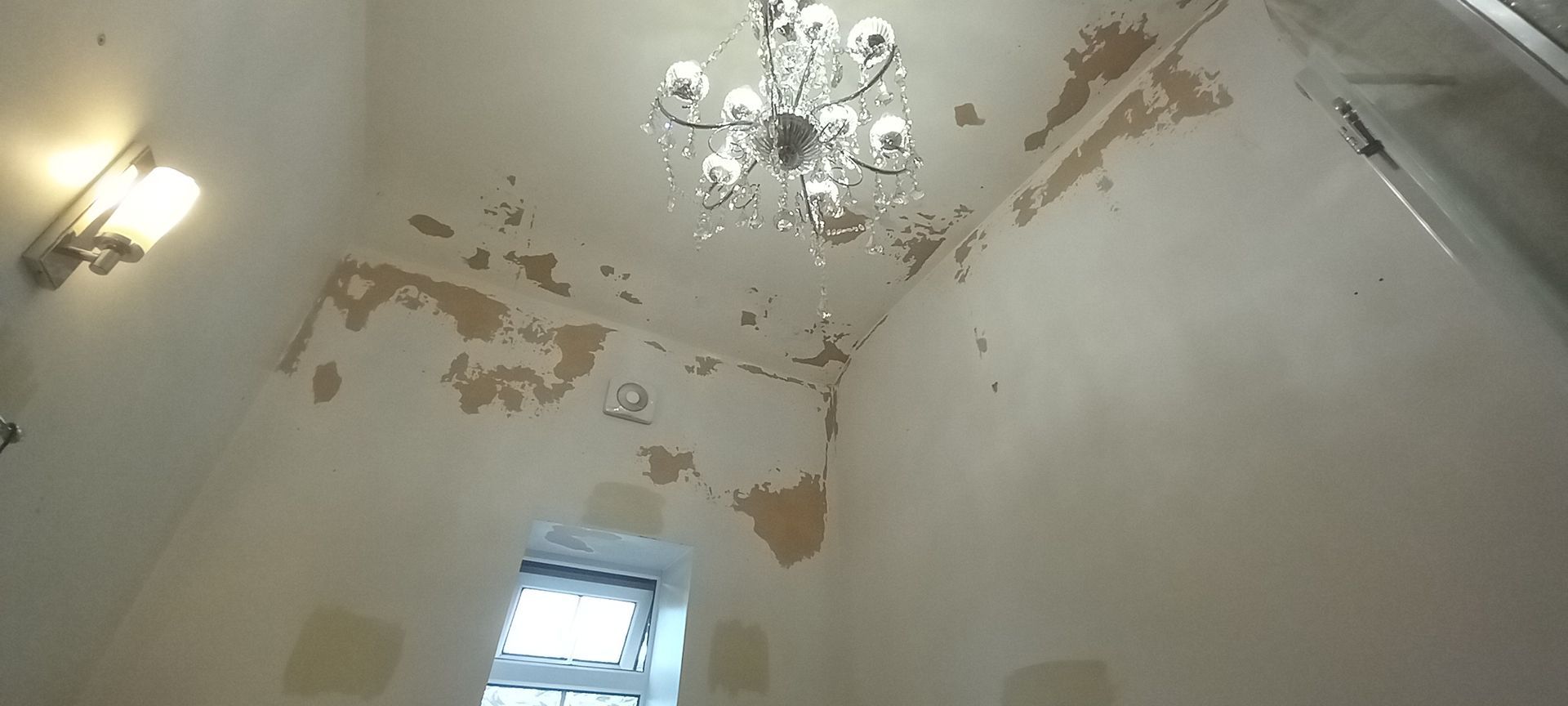 Poor prior painting causing widespread flaking – carefully rubbed back, sealed and primed for breathable, long-lasting finish