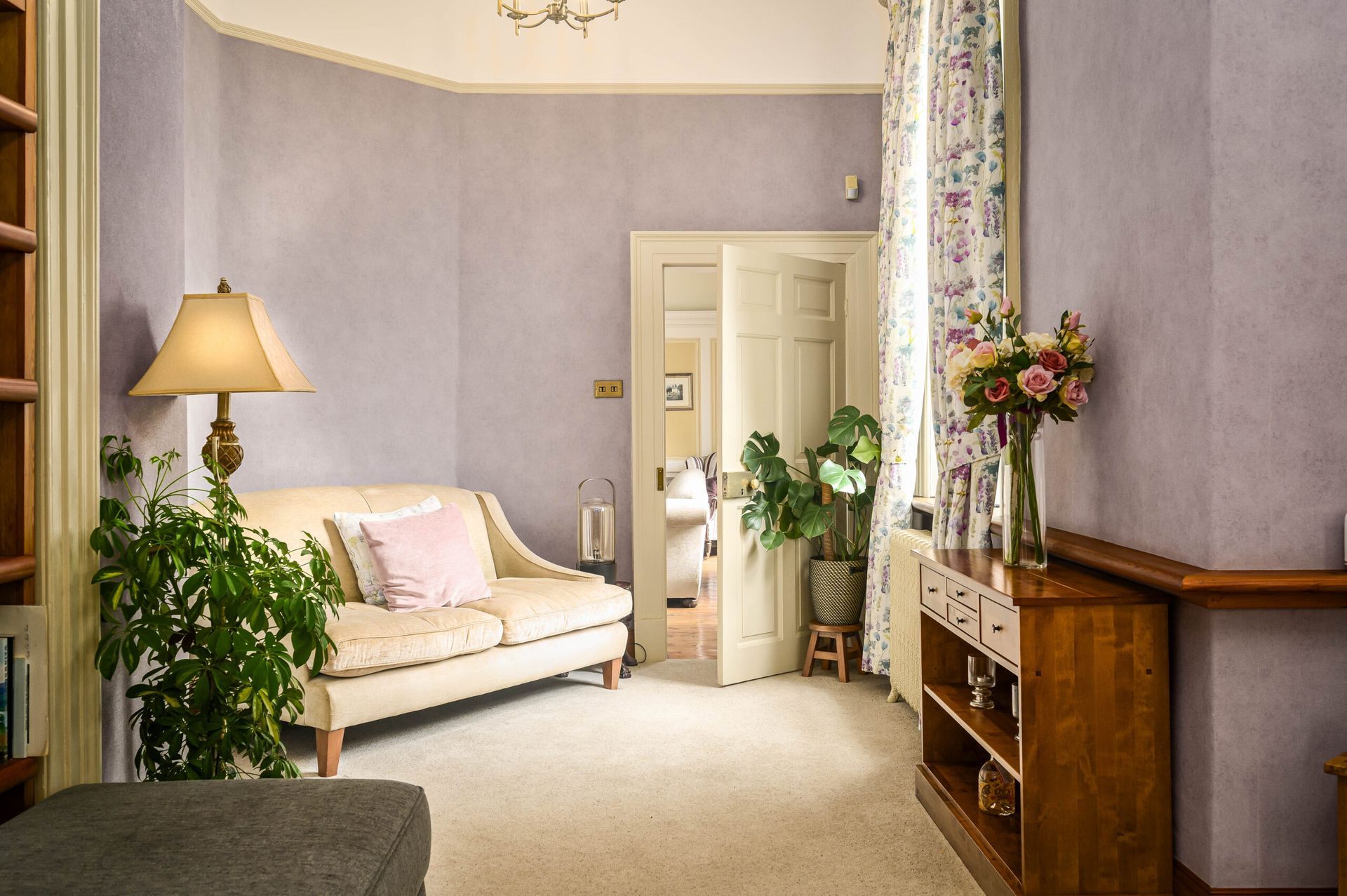 Flawlessly completed specialist wallcovering – delicate floral accents and soft tones creating a cherished, enduring space