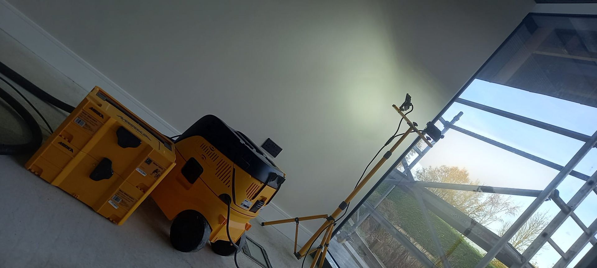 Careful substrate prep across modern workspace – dust-free sanding and protection 