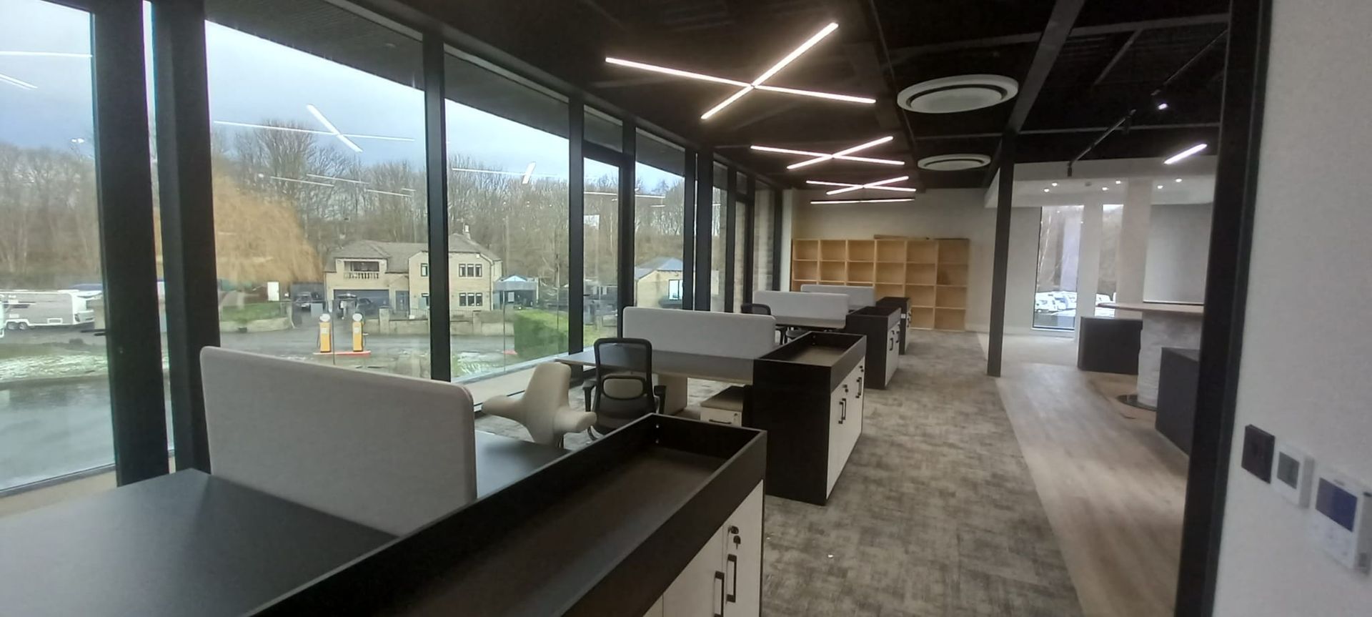 Modern open-plan workspace refresh – exposed structure and glass partitions painted for sophisticated look