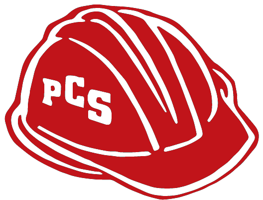 A red hard hat featuring the white letters "PCS" on its side.