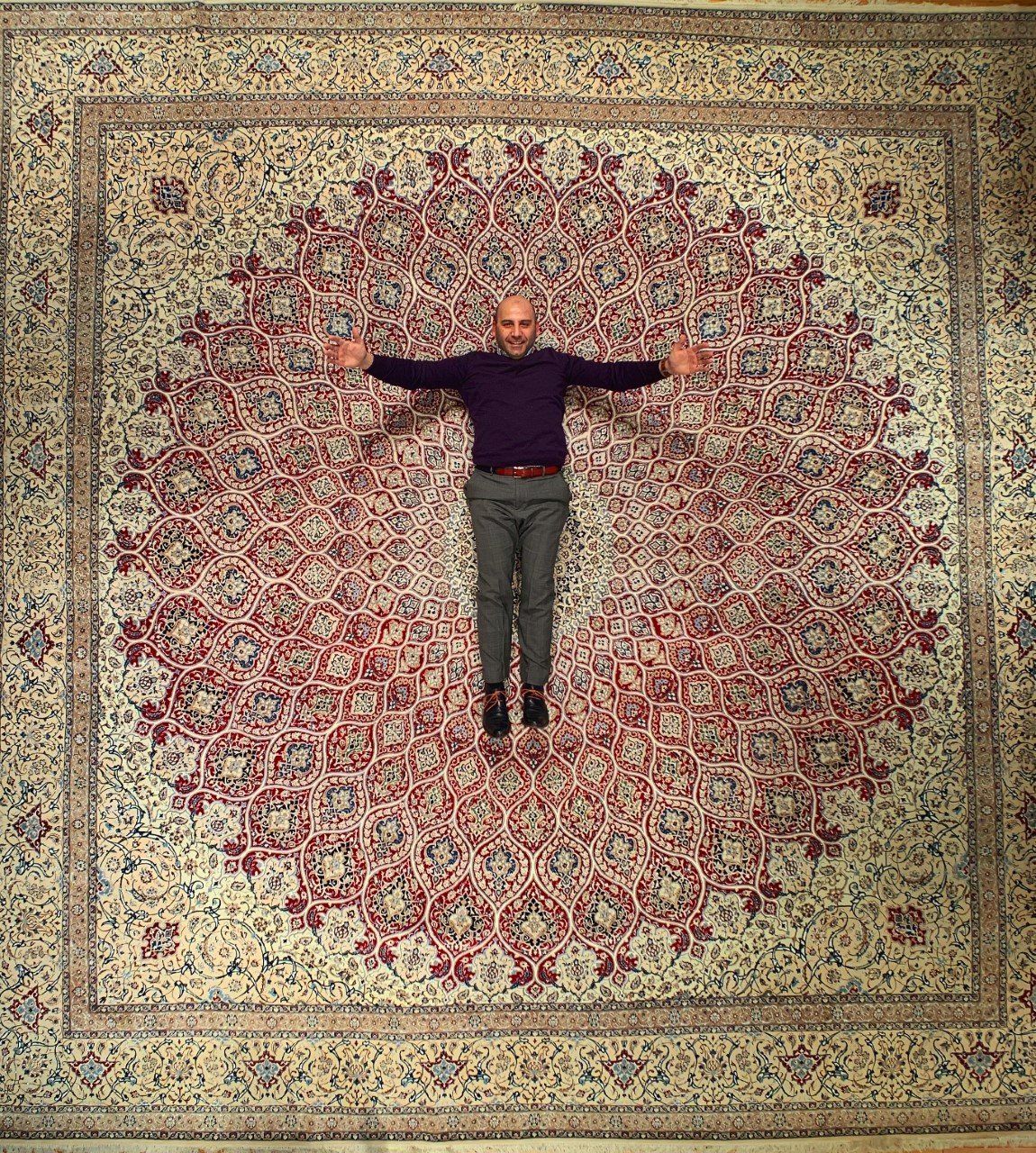Man with Big Transitional Rug — Milwaukee, WI — Shabahang and Sons Persian Carpets