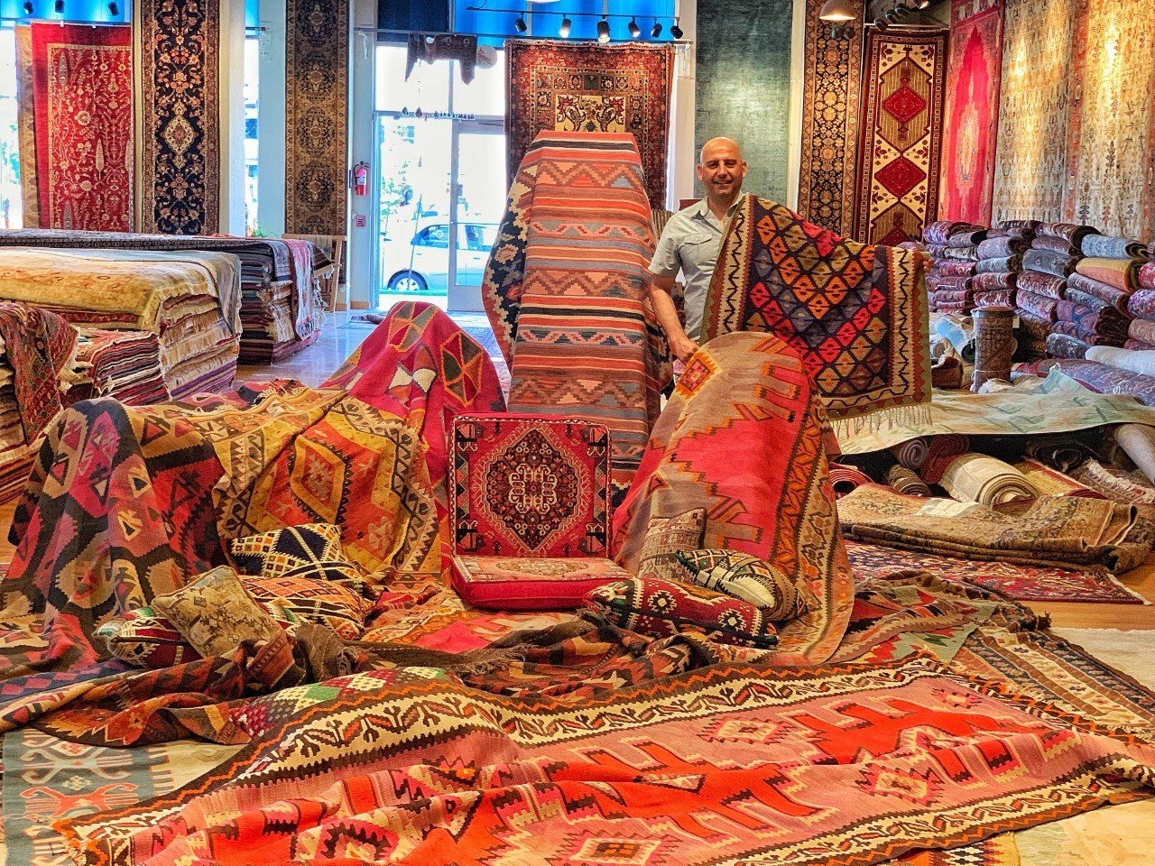 Man with Custom Rugs — Milwaukee, WI — Shabahang and Sons Persian Carpets