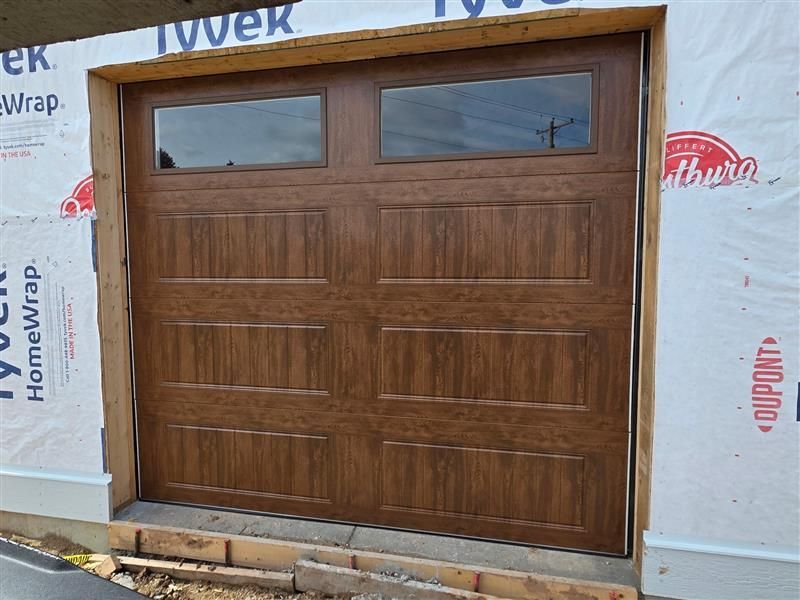 An empty garage with a heater and a fire extinguisher