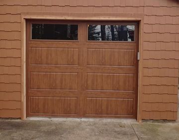 Wooden Garage Door With Two Windows — Port Washington, WI — Jiffy Overhead Door, LLC