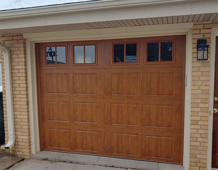 Wooden Garage Door With Four Windows — Port Washington, WI — Jiffy Overhead Door, LLC