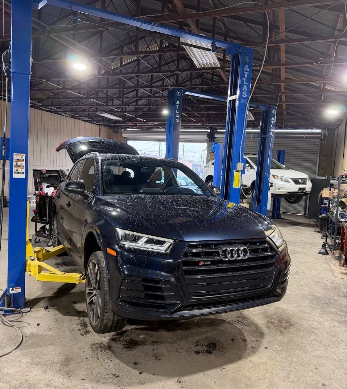 Dark Blue Audi Jacked Up | 5G Auto Service & Bodyshop
