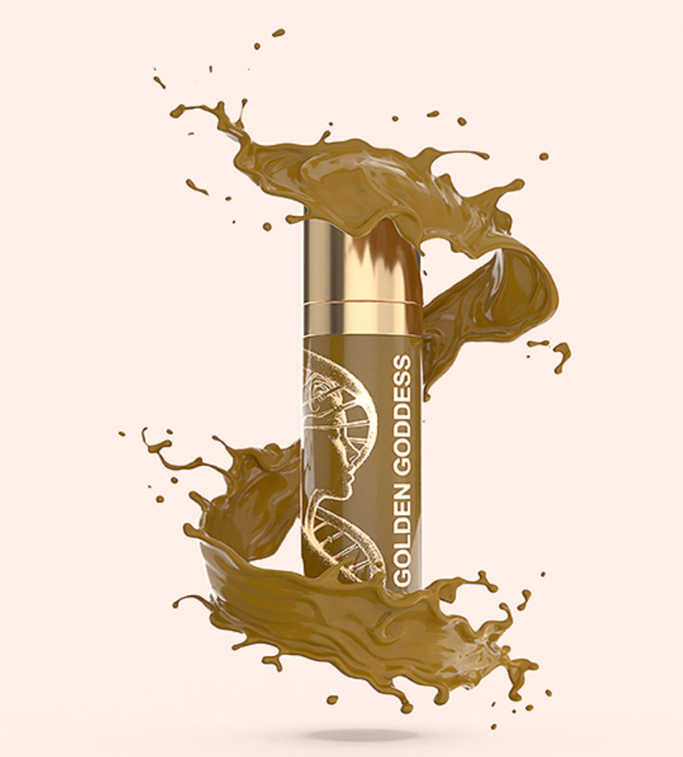 A bottle of golden goddess liquid foundation with a splash coming out of it.