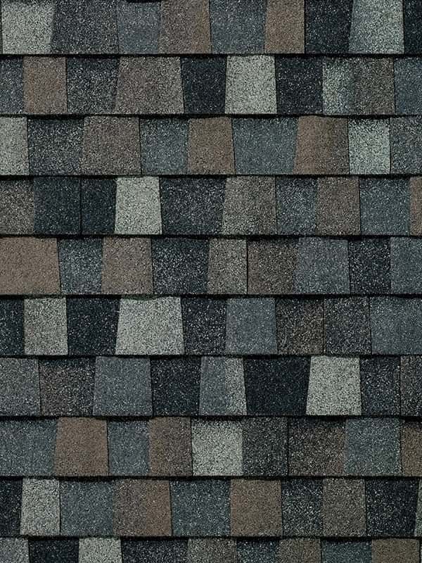 A close up of a roof with a lot of shingles on it.
