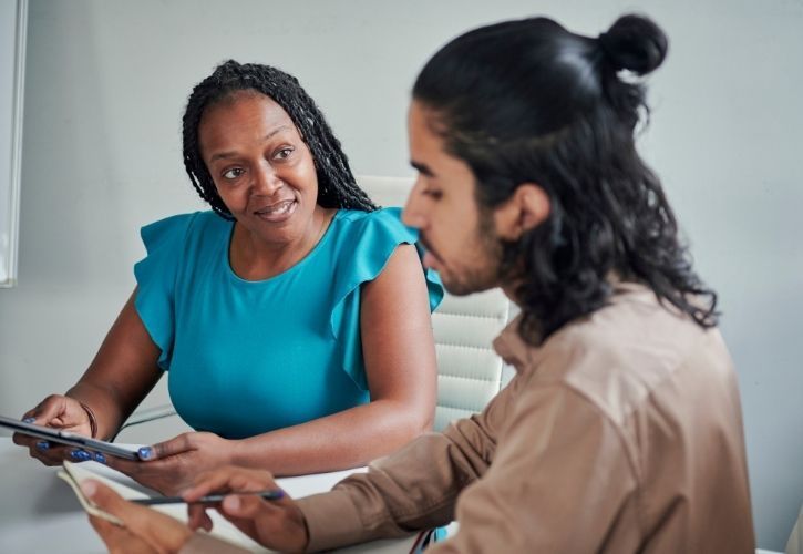a businesswoman mentoring a coworker