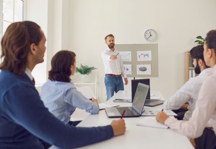 a leader coaching employees