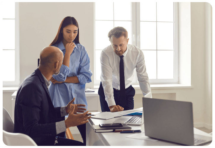 three people discussing business