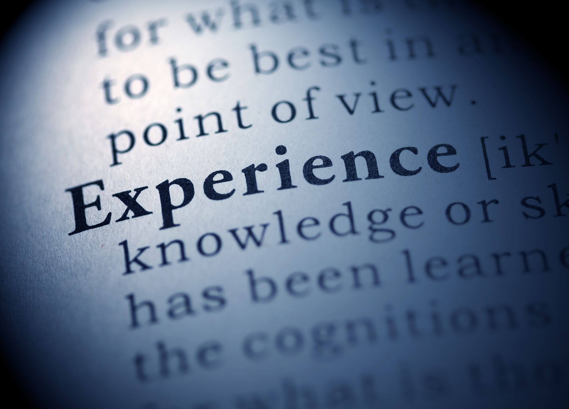 A close up of the word experience in a dictionary