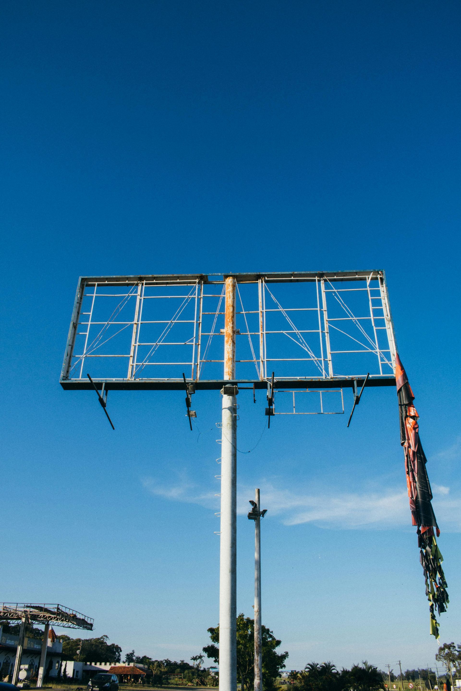 A large billboard with a blue sky in the background