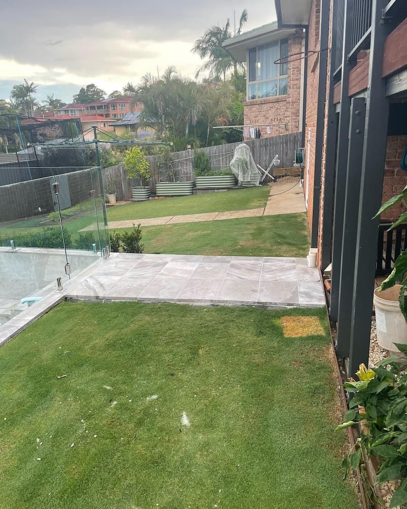 There Is A Swimming Pool In The Backyard Of A House — Millers Masonry In Port Macquarie, NSW