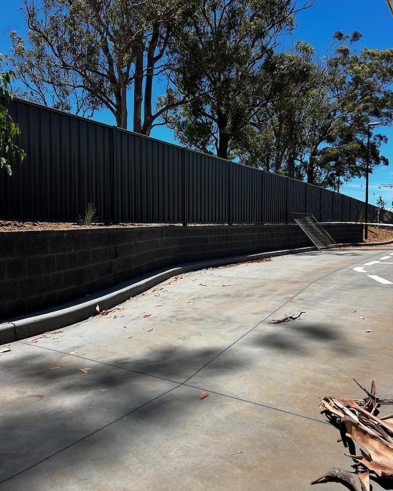 Commercial Brick Wall with Fence— Millers Masonry In Port Macquarie, NSW