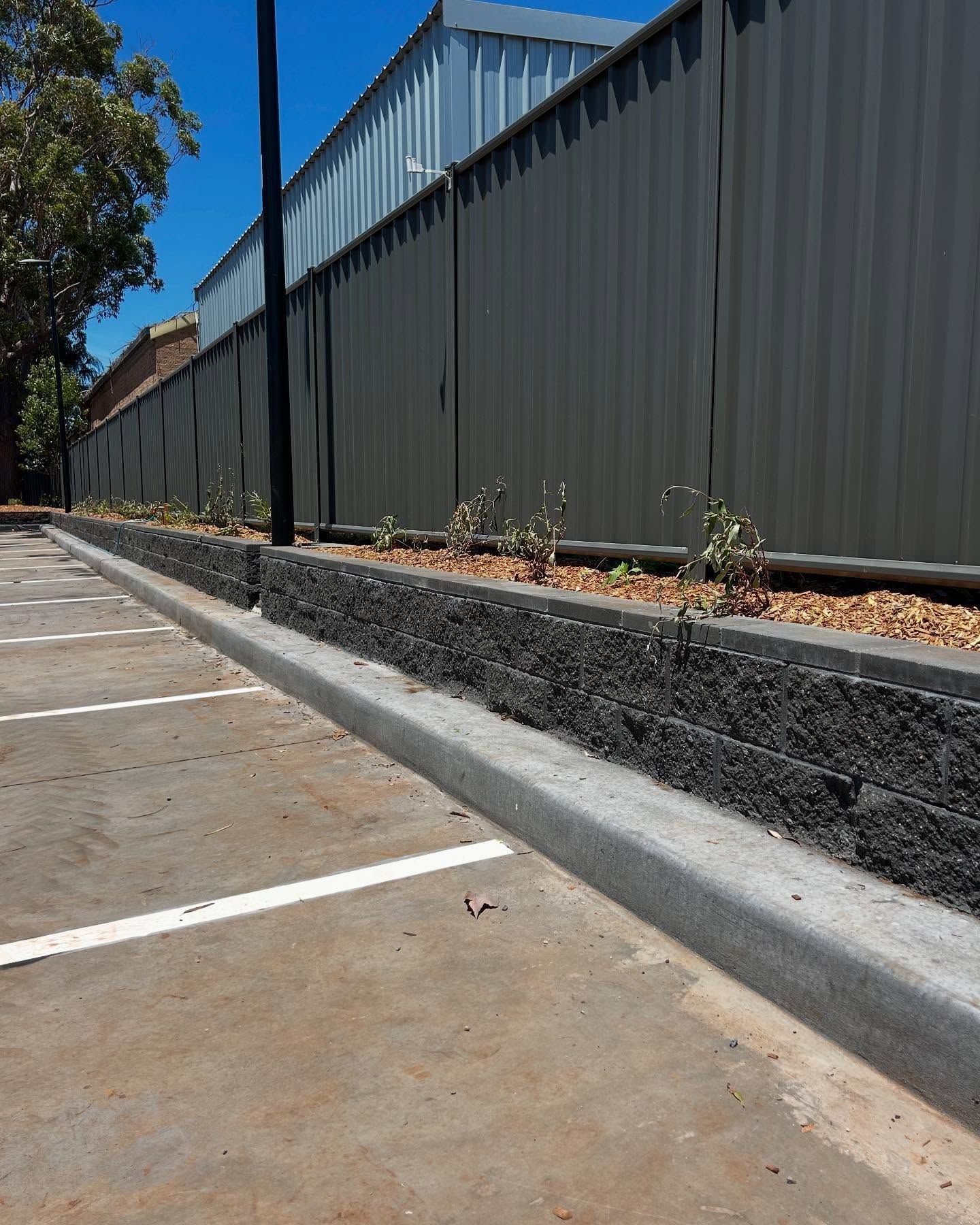 Commercial Brick Wall with Fence — Millers Masonry In Kempsey, NSW