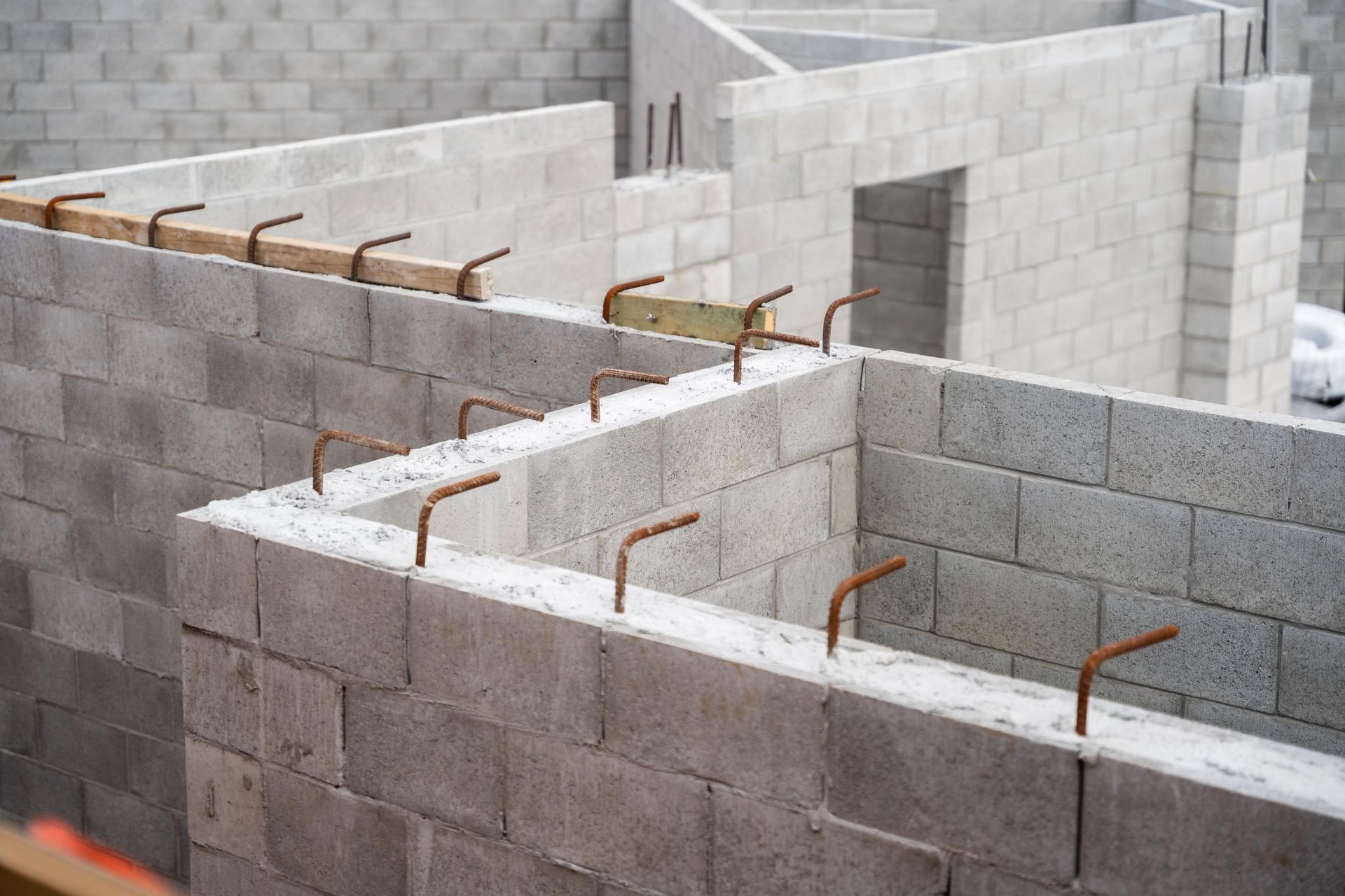 Concrete Block Wall Construction with Rebar Protruding from The Top — Millers Masonry In Taree, NSW