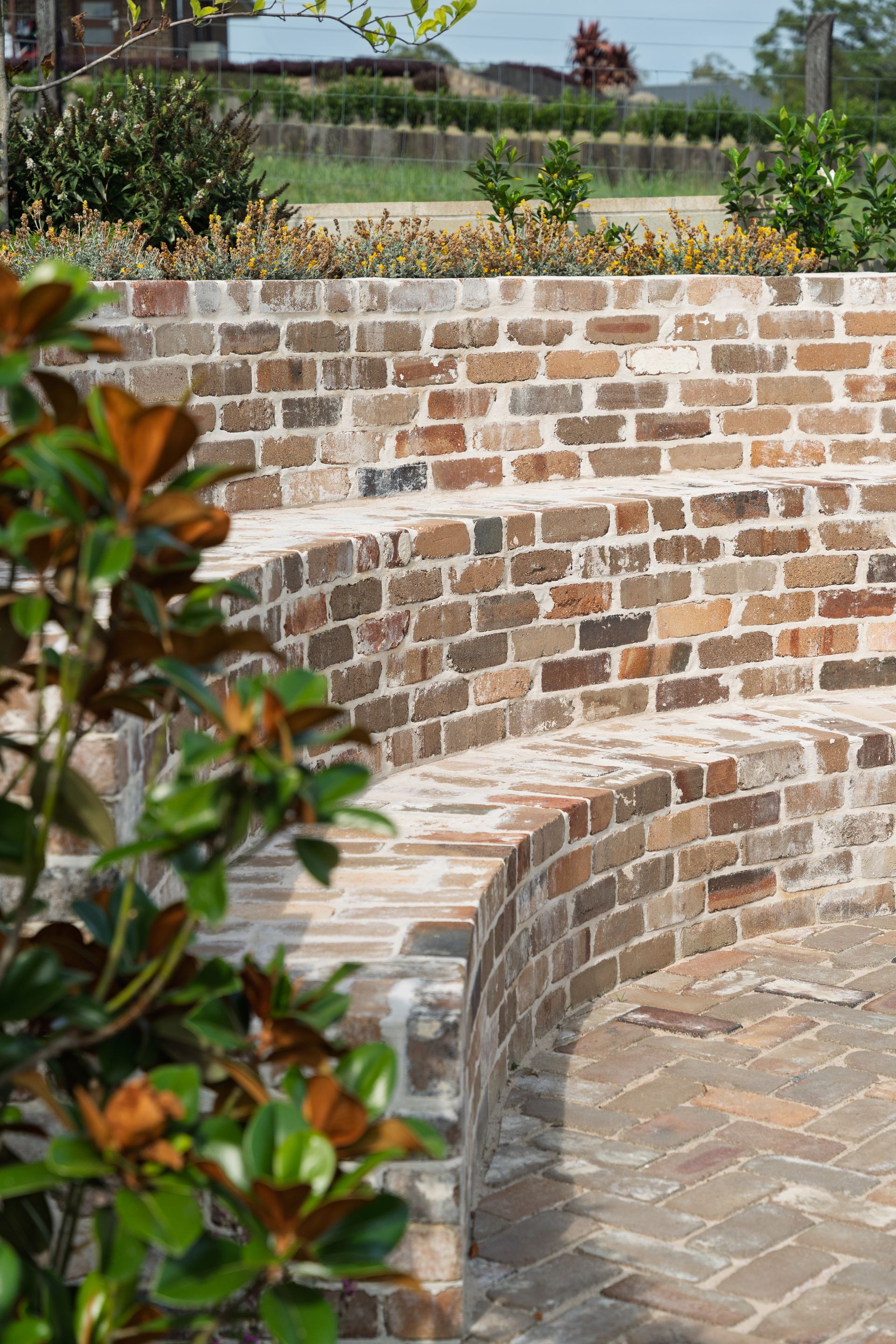Construction Site with Gray Block Walls, a Blue House — Millers Masonry In Port Macquarie, NSW