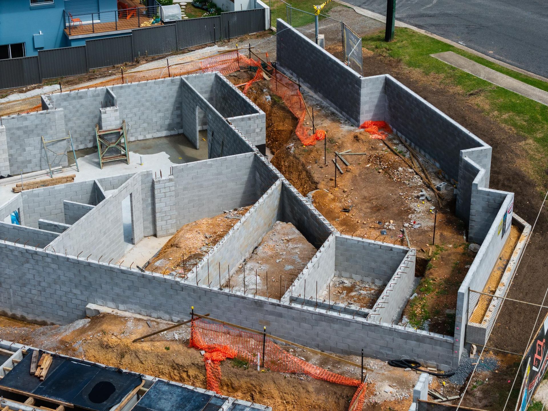 Construction Site with Gray Cinder Block Walls Forming Building Foundation — Millers Masonry In Port Macquarie, NSW