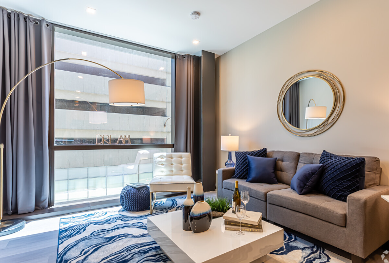 A living room filled with furniture and a fireplace.
