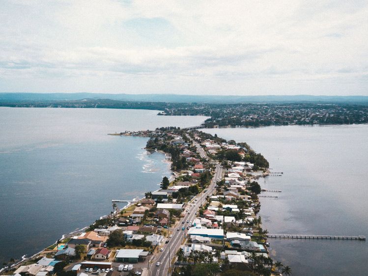 An Aerial View of a City next to a Large Body of Water — Bersantai Medispa in Toukley, NSW