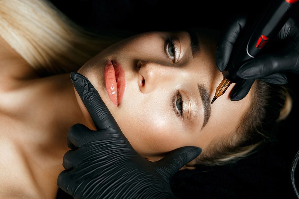 Woman Having a Permanent Eyeliner Makeup — Bersantai Medispa in Toukley, NSW