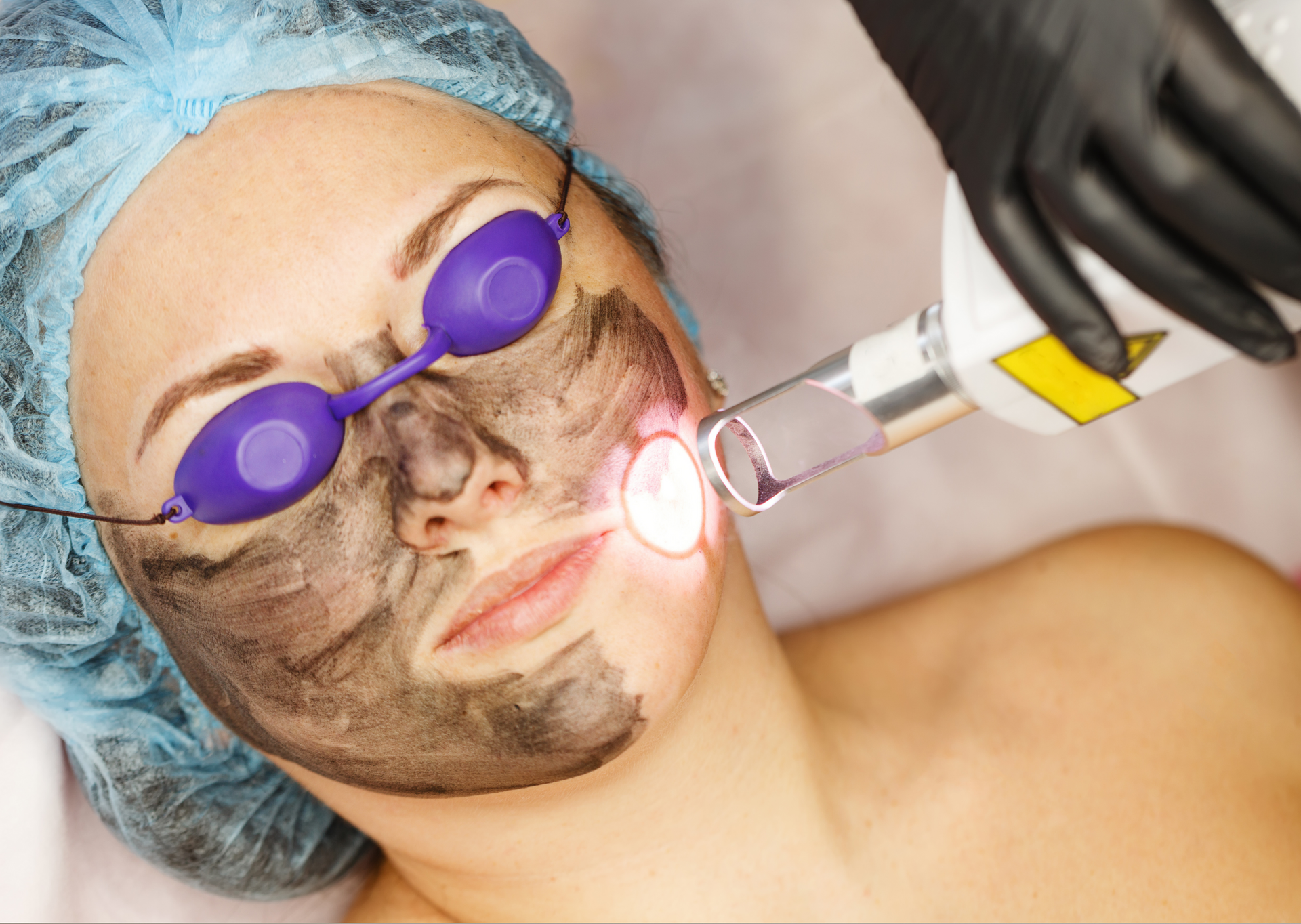 Beautiful Young Woman Having a Facial Cosmetic Treatment — Bersantai Medispa in Toukley, NSW