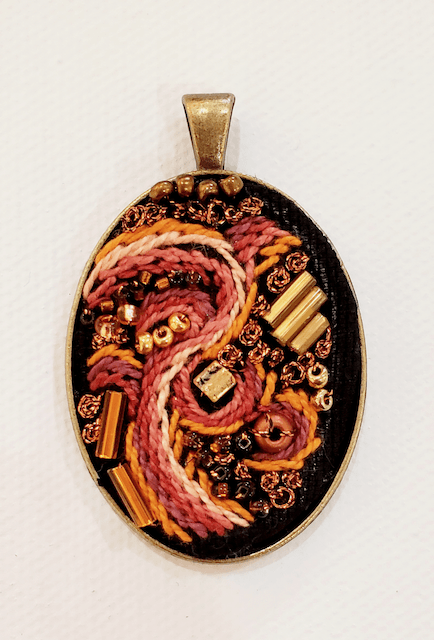 A pendant with a dragon design on it